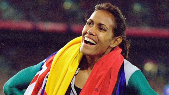 25 Sep 2000:  Cathy Freeman of Australia celebrates gold in the Womens 400m Final at the Olympic Stadium on Day Ten of the Sydney 2000 Olympic Games in Sydney, Australia. \\ Mandatory Credit: Nick Wilson /Allsport