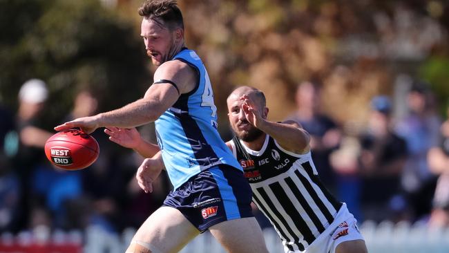 Sturt midfielder Aidan Riley gets a kick in Wednesday’s win over Port Adelaide. The SANFL is investigating claims of abusive language in the crowd from the game. Picture: Matt Turner.