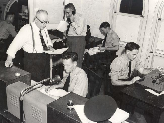 1952: The murder of 23-year-old Betty Shanks shocked the nation and police set up a special communications room in the Brisbane CIB offices to co-ordinate one of the biggest manhunts in Queensland's history, led by Inspector J.E. Donovan (in glasses and braces). The crime remains unsolved to this day.