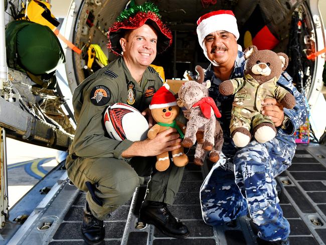 Pilot Adam D'Arcy and Liaison Officer Normie Grogan of No. 35 Squadron RAAF will aid in the Christmas Present drop to the Torres Strait Islands. Picture: Alix Sweeney