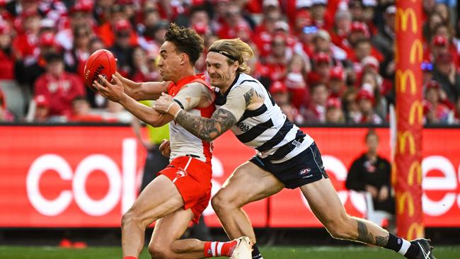 Ryan Clarke is run down by Tom Stewart. Picture: Daniel Carson/AFL Photos via Getty Images