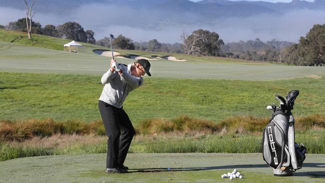 Greg Norman hits a few balls at the opening of the Cathedral Lodge golf course in 2017. Picture: David Crosling