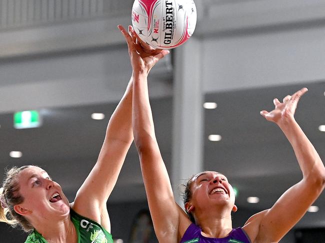 Jemma Mi Mi and Jess Anstiss challenge for the ball during their Round 9 Super Netball match between the Queensland Firebirds and the West Coast Fever.