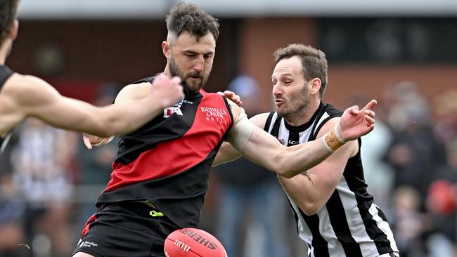 Dylan Tarczon gets a kick under pressure for Riddell. Picture: Andy Brownbill