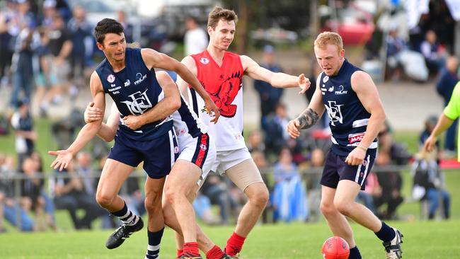 Flagstaff Hill and Noarlunga players battle for the ball during the Southern Football League grand final last year. Picture: AAP/Keryn Stevens.