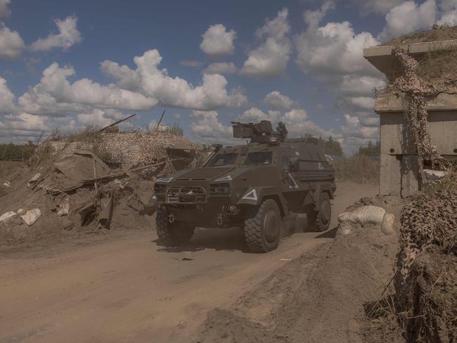 A Ukrainian military vehicle driving past a destroyed border crossing with Russia. Kyiv launched a surprise offensive into the Russian border region of Kursk and Moscow is trying to take back the land. Picture: AFP