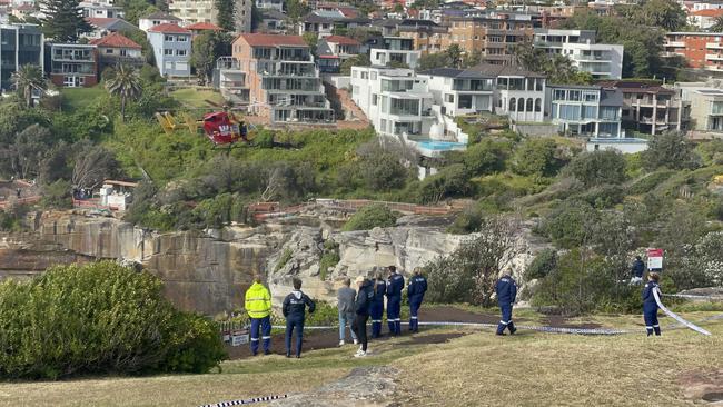 A Westpac helicopter arrived at Vaucluse on Friday morning to help retrieve a body found in waters off The Gap.