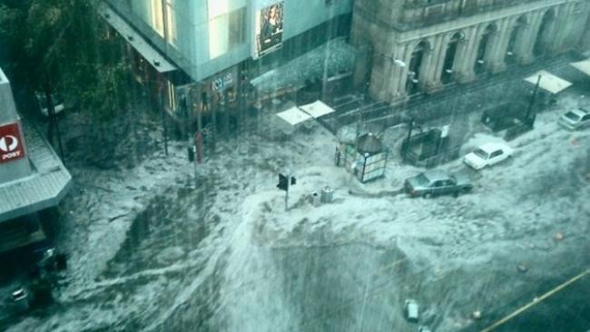 An almost apocalyptic image from a 2010 flood as rain crashes down on Melbourne’s CBD.