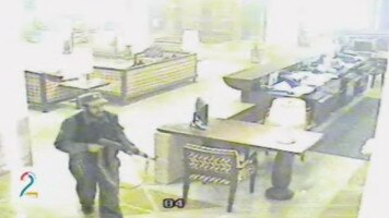 Shot of one terrorists on a CCTV surveillance camera in the lobby of the Serena Hotel in Kabul.