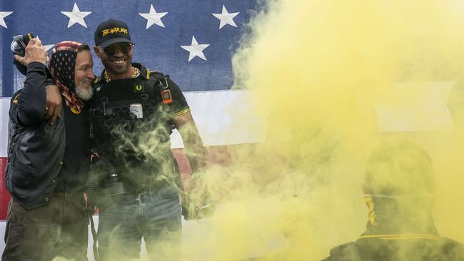 Proud Boy leader Enrique Tarrio, right, hugs a fellow member during a Proud Boy rally in Portland, Oregon. Picture: AFP.