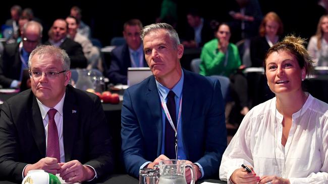 Scott Morrison with National Farmers' Federation CEO Tony Maher and MC Catherine Marriott at the NFF national congress in Canberra yesterday. Picture: AAP