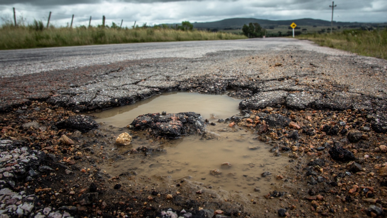 NSW government pledges more than $500m in funding to fix potholes on roads