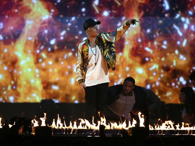 Fiery show ... singer Justin Bieber performs onstage at the Brit Awards. Picture: Joel Ryan/Invision/AP