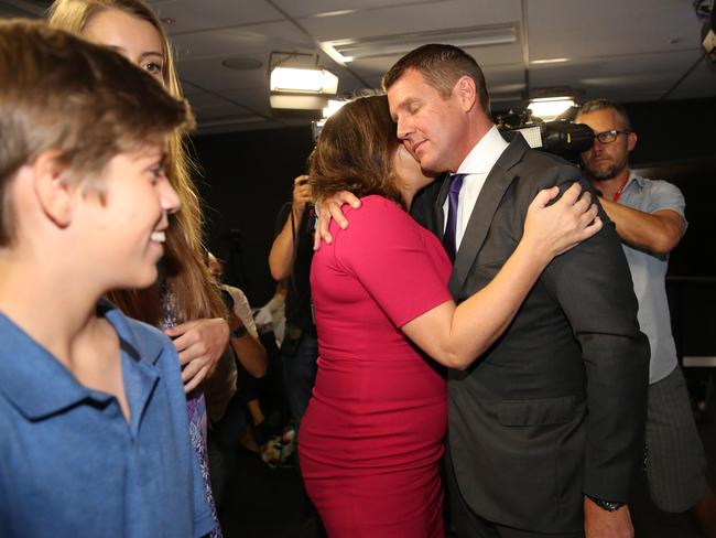 Mike Baird hugs his wife Kerryn. Picture: Ryan Osland