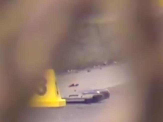 The replica gun lying on the ground at the crime scene. Picture: 7 NEWS