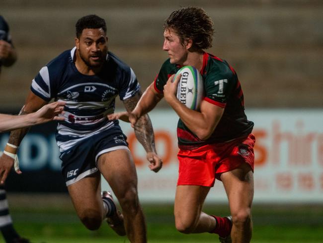 Action from Darwin A-grade Rugby Union Round 4: Casuarina Cougars v South Darwin Rabbitohs at Rugby Park, Marrara. Fly Half David Nicol with a grip on the ball under pressure.Picture: Che Chorley