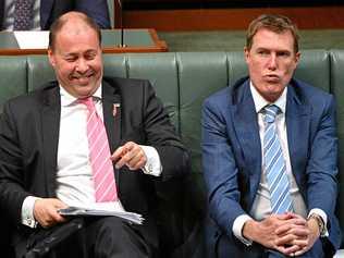 ALL SMILES: Treasurer Josh Frydenberg, left, has delivered a budget being lauded by some, but hides plenty of harsh measures. Picture: MICK TSIKAS