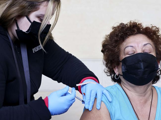 A person receives a vaccination booster shot at Union Station in Los Angeles. More than 37,000 new cases of Covid-19 were reported by Los Angeles County amid the continued spread of the Omicron variant. Picture: Mario Tama/Getty Images/AFP