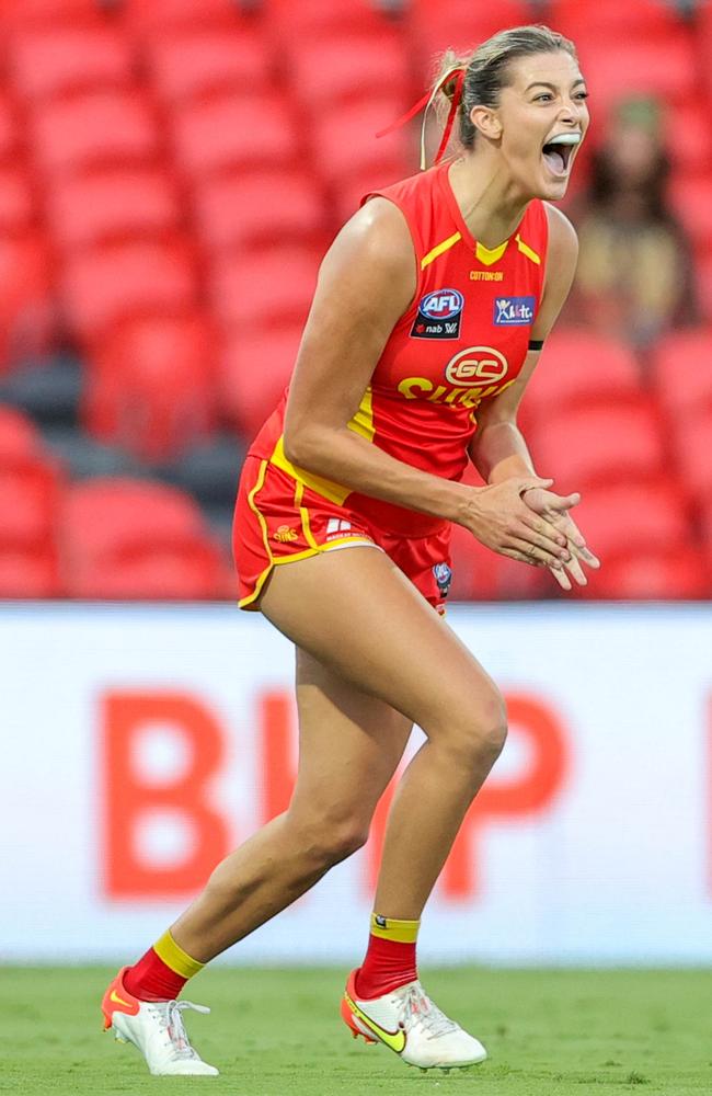 Inaugural Great Barrier Reef Arena ambassador Lauren Bella of the Suns celebrates a goal during the 2022 AFLW Round 06 match between the Gold Coast Suns and the Geelong Cats at Metricon Stadium on February 11, 2022 in the Gold Coast, Australia. Picture: Russell Freeman/AFL Photos.