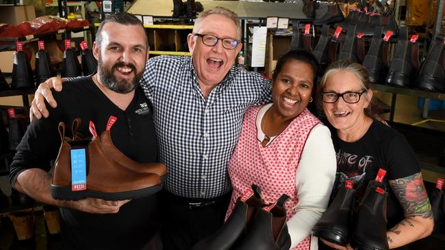 Rossie Boots Myron Mann (checked shirt) and employees in happier times. Picture: Tricia Watkinson.