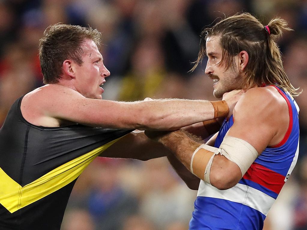 Dylan Grimes objects to Josh Bruce’s grub act. (Photo by Dylan Burns/AFL Photos via Getty Images)