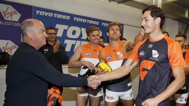 Debutant Jake Stein receives his GWS Giants jumper on Sunday. Picture: Dylan Burns/AFL Photos via Getty Images.