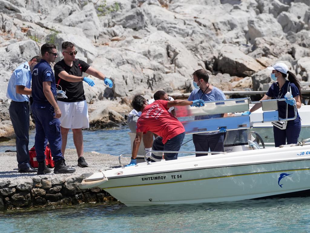 Emergency services lifting an empty stretcher off a boat at Agia Marina in Symi, Greece, where a body has been discovered during a search and rescue operation for TV doctor and columnist Michael Mosley. Picture: Getty Images