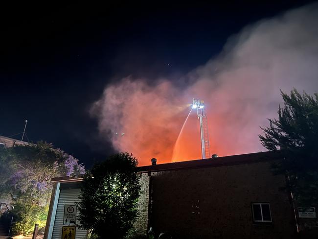 Residents living nearby have been warned to stay indoors and avoid the potentially dangerous black smoke spewing form the blaze. Picture: Fire and Rescue NSW