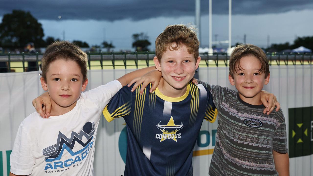 Young Cowboys fans River Mostert, 7, Mason Mostert, 8, and Odin Mostert, 7, cheer on their team in the NRL preseason match between the North Queensland Cowboys and the Dolphins, held at Barlow Park. Picture: Brendan Radke