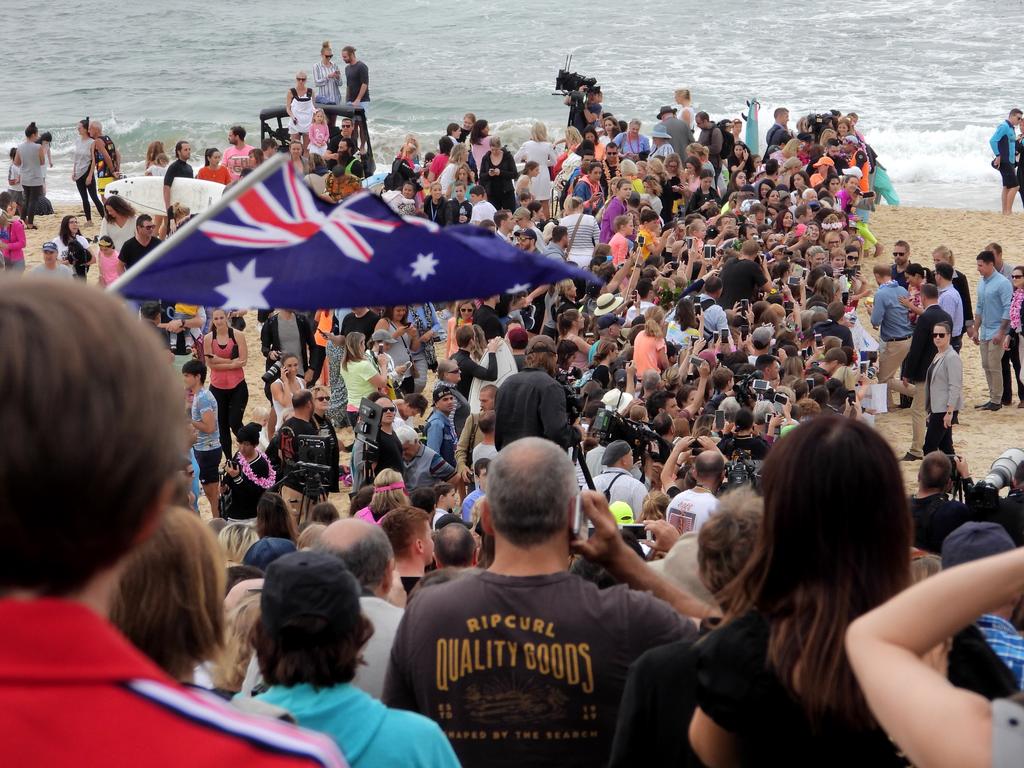 Meghan and Harry on Bondi beach meeting the locals. Picture: John Grainger