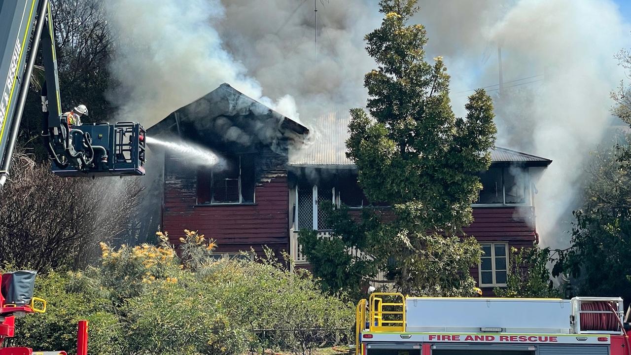 Nine fire crews and an ambulance were called to the fire on Breakfast Creek Rd at Newstead about 11.30am. Picture: Steve Pohlner