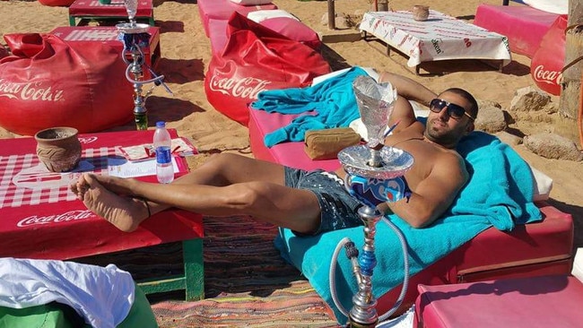 Mina Saad, convicted of swindling more than $250,000 from his former employer Polivac International Ltd, lounges on the beach in Dubai during the time of his offending. Picture: Facebook