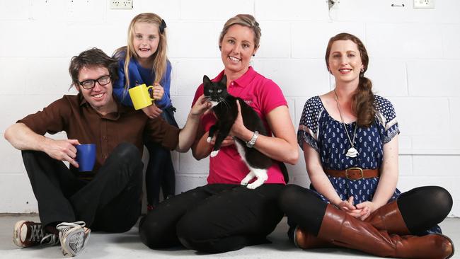 Owners Adam and Dimity Honeyman with daughter Israel 6 and Abby Laskey (pink top) Manager of the RSPCA Hobart Centre with Dimity the kitten. The Hobart Cat Cafe is set to open in the coming months in North Hobart. Picture Nikki Davis-Jones