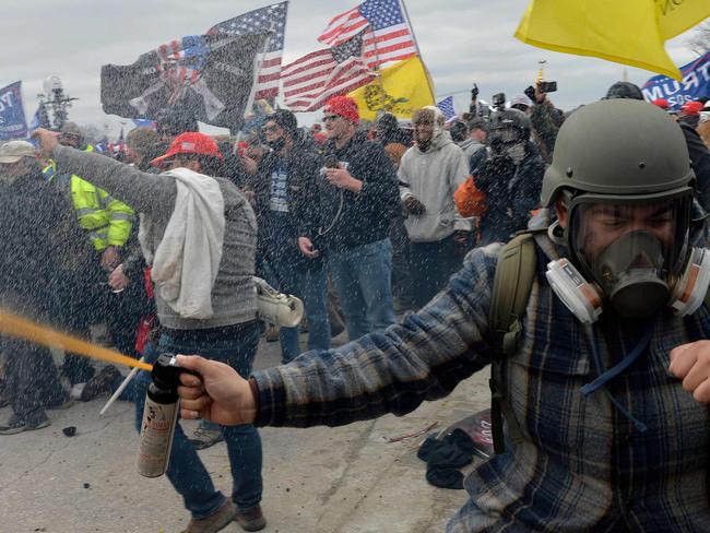 Trump supporters clash with police and security forces as people try to storm the US Capitol Building in Washington, DC, on January 6, 2021. - Demonstrators breeched security and entered the Capitol as Congress debated the a 2020 presidential election Electoral Vote Certification. (Photo by Joseph Prezioso / AFP)