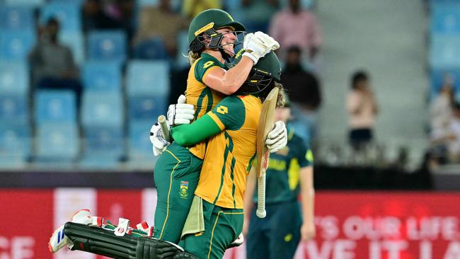 Player of the match Anneke Bosch (left) and Chloe Tryon celebrate after South Africa beat Australia for just the second time to reach the T20 World Cup final. Picture: Giuseppe Cacacae / AFP