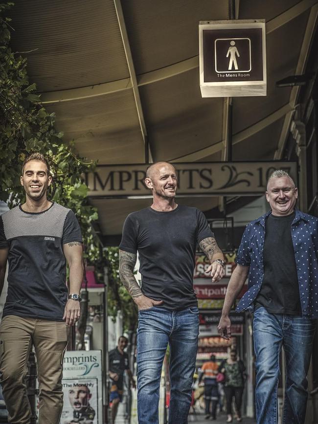 Darren Gilmore with his work colleagues outside their Hindley St shop. Picture: Supplied
