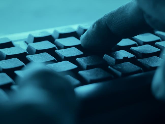 Hands typing on desktop pc computer keyboard