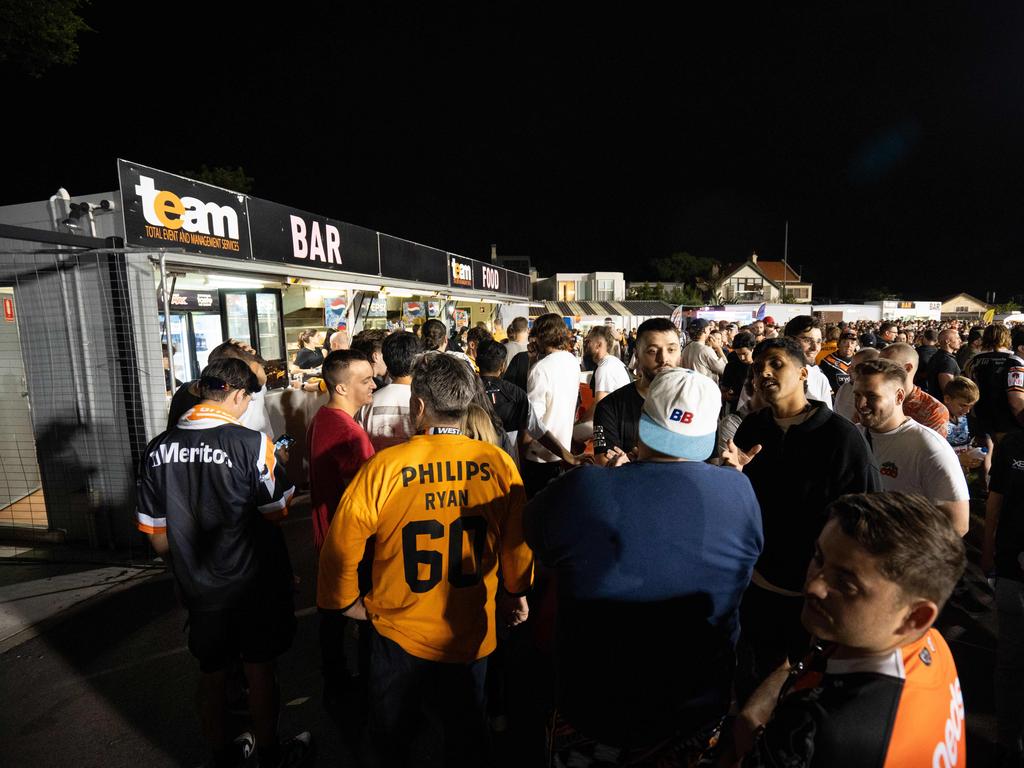 Lines or the bars stretched to extreme lengths at Leichhardt Oval on Saturday night. Picture: Tom Parrish