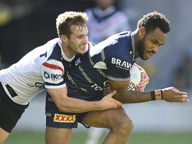 Hamiso Tabuai-Fidow of the Cowboys is tackled by Sam Walker of the Roosters during the round 18 NRL match between the North Queensland Cowboys and the Sydney Roosters. (Photo by Ian Hitchcock/Getty Images)