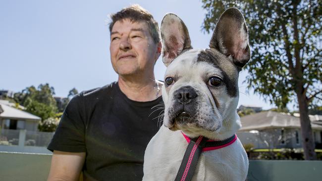 Alan Williams was ambushed in the middle of a street at Ormeau by three men who got out of a car and tried to steal his French bulldog, Chilli. Picture: Jerad Williams