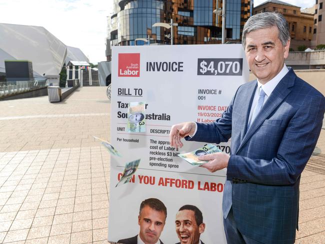 Former treasurer Rob Lucas holding fake Labor money during a presser about election spending. Picture: NCA NewsWire / Brenton Edwards