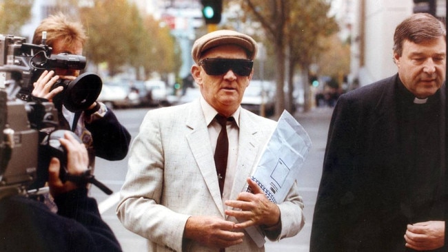 Gerald Ridsdale outside court in 1993 with George Pell. Picture: Geoff Amp