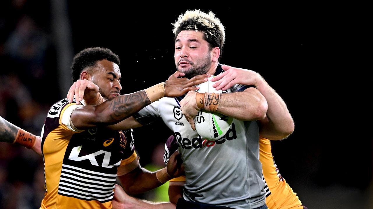 BRISBANE, AUSTRALIA - AUGUST 19: Brandon Smith of the Storm attempts to break free from the defence during the round 23 NRL match between the Brisbane Broncos and the Melbourne Storm at Suncorp Stadium, on August 19, 2022, in Brisbane, Australia. (Photo by Bradley Kanaris/Getty Images)