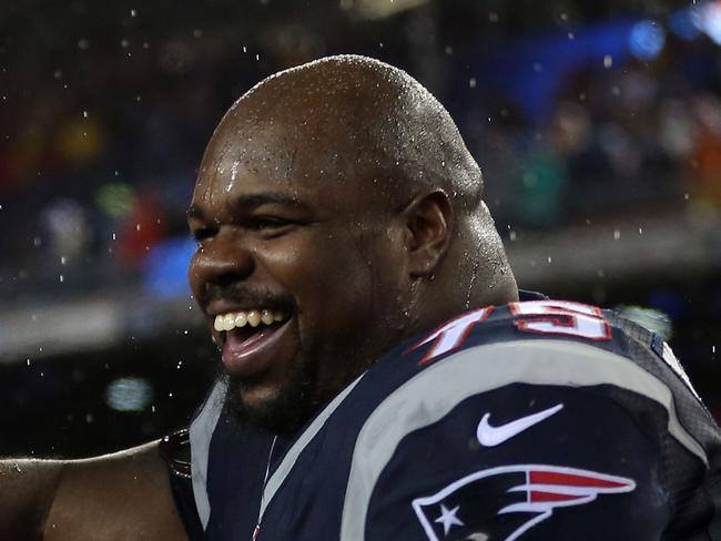FOXBORO, MA - JANUARY 18: Chandler Jones #95 and Vince Wilfork #75 of the New England Patriots celebrate after defeating the Indianapolis Colts in the 2015 AFC Championship Game at Gillette Stadium on January 18, 2015 in Foxboro, Massachusetts. The Patriots defeated the Colts 45-7. Jim Rogash/Getty Images/AFP == FOR NEWSPAPERS, INTERNET, TELCOS & TELEVISION USE ONLY ==