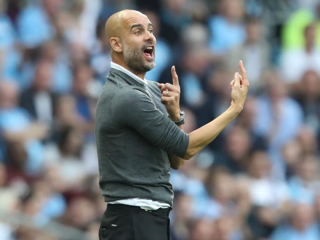 Manchester City's Spanish manager Pep Guardiola gestures on the touchline during the English Premier League football match between Manchester City and Newcastle United at the Etihad Stadium in Manchester, north west England, on September 1, 2018. (Photo by Lindsey PARNABY / AFP) / RESTRICTED TO EDITORIAL USE. No use with unauthorized audio, video, data, fixture lists, club/league logos or 'live' services. Online in-match use limited to 120 images. An additional 40 images may be used in extra time. No video emulation. Social media in-match use limited to 120 images. An additional 40 images may be used in extra time. No use in betting publications, games or single club/league/player publications. /