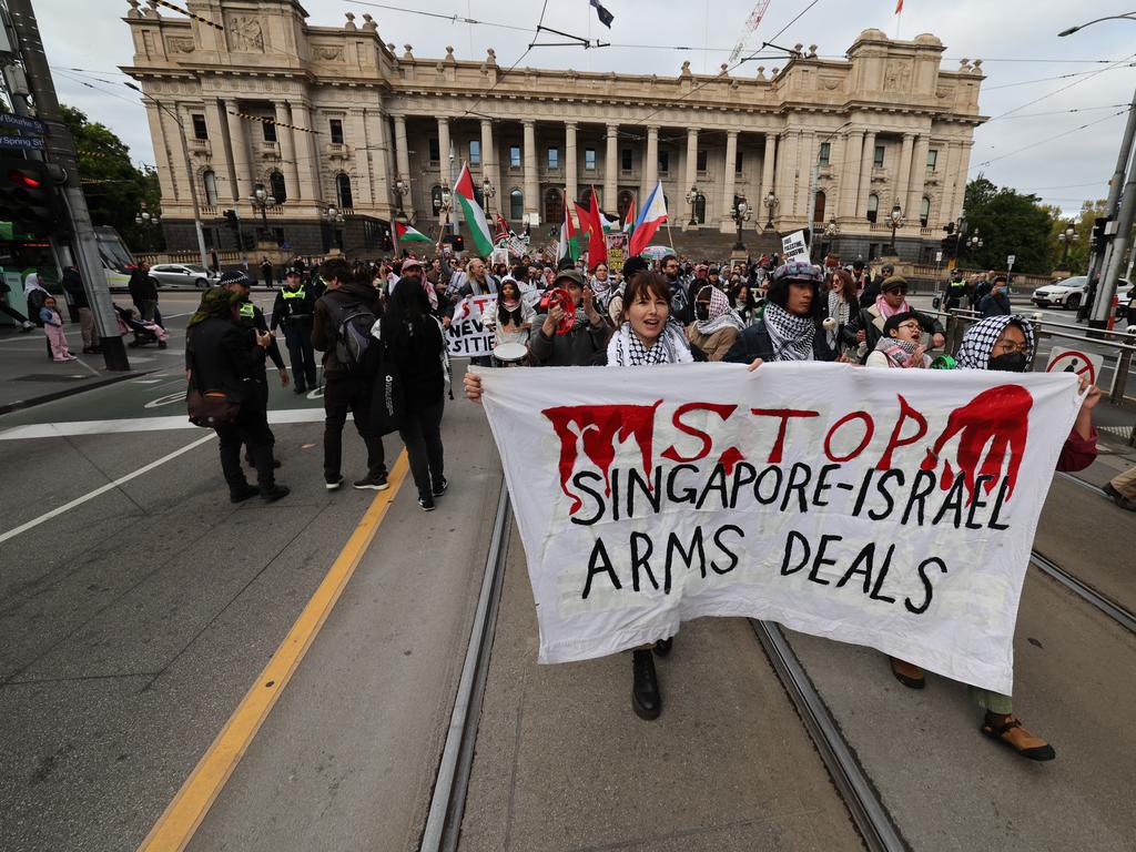 Protesters marching down Bourke Street in Melbourne. Picture: David Caird