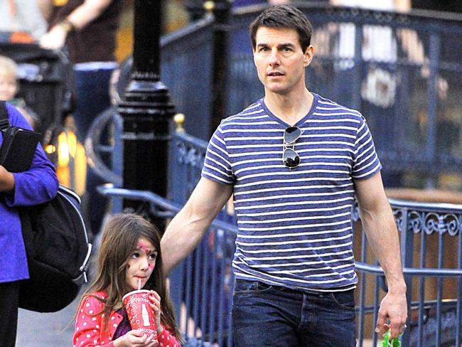 Tom Cruise and his little princess Suri spent some quality father daughter time at Disneyland. The duo were spotted throughout the park snacking on cotton candy and sipping on some soda. They were also seen shopping for some stuffed Disney characters and climbing up Tarzan's Treehouse. Pictured: Tom Cruise and Suri Cruise Ref: SPL353726 250112 Picture by: Sharpshooter Images/Splash News Splash News and Pictures Los Angeles: 310-821-2666 New York: 212-619-2666 London: 870-934-2666 photodesk@splashnews.com