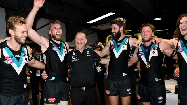 Coach Ken Hinkley of the Power (centre) celebrates with his team after their win in the round 8 AFL match between the Gold Coast Suns and the Port Adelaide Power at Jiangwan Stadium in Shanghai, China, Sunday, May 14, 2017. (AAP Image/Tracey Nearmy) NO ARCHIVING, EDITORIAL ONLY