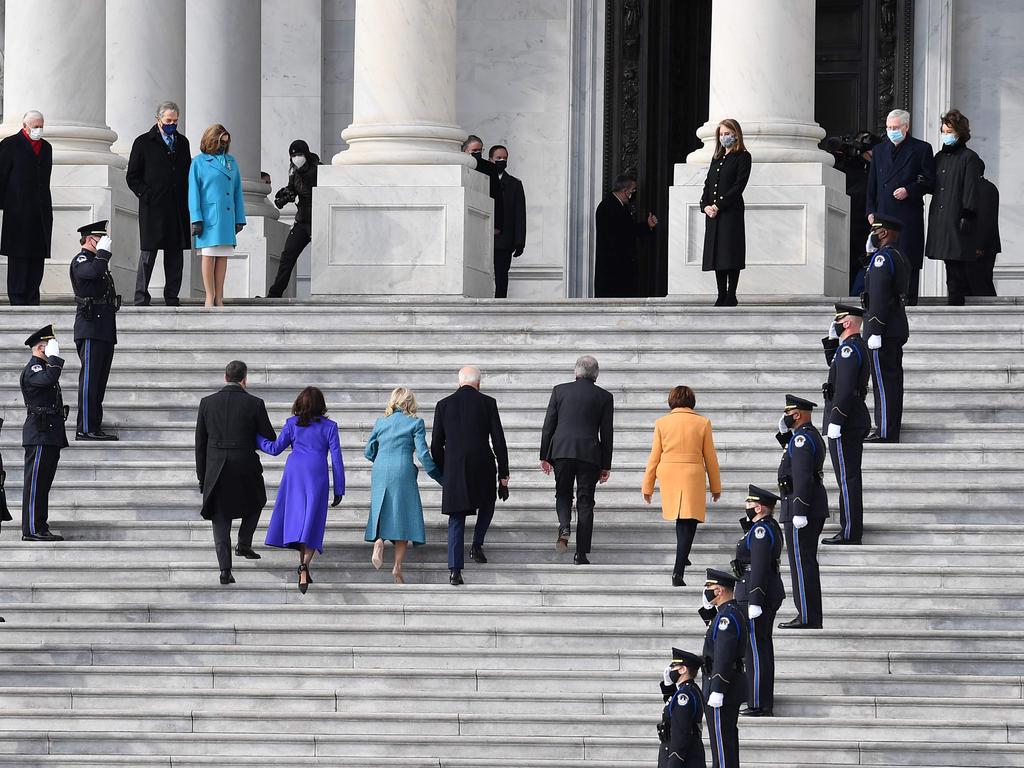 Joe Biden and wife Jill along with Kamala Harris and husband Doug Emhoff walk up the same stairs as they arrive at the Capitol for the inauguration. Picture: Angela Weiss/AFP