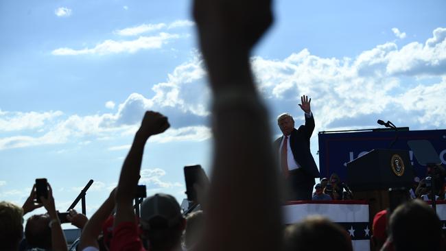 Trump waves as supporters cheer after a speech in Wisconsin. Picture: AFP